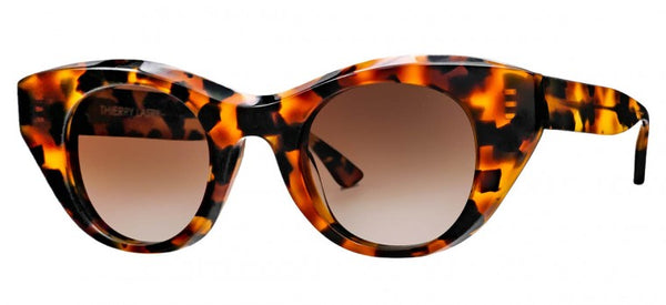 The Thierry Lasry Snappy Sunglasses, a pair of tortoiseshell pattern sunglasses with Italian acetate cat-eye frames and brown tinted lenses, offer UV protection.