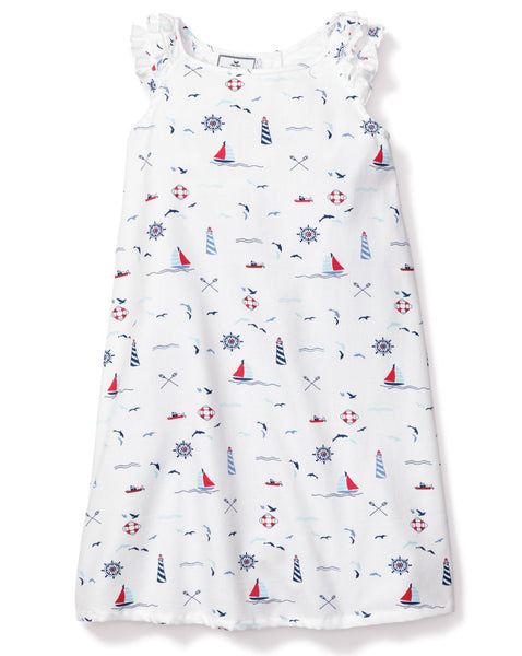 Introducing the Petite Plume Girls' Sail Away Amelie Nightgown by Petite Plume, a white sleeveless nightgown adorned with nautical-themed prints such as sailboats, lighthouses, and lifebuoys. Featuring elegant ruffled shoulder details, it's perfect for maritime leisure.