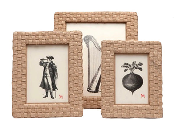 Three Pigeon and Poodle Genova Frame Collection each containing a black and white illustration; from left to right, a man with a camera, a harp, and a decorative bomb.