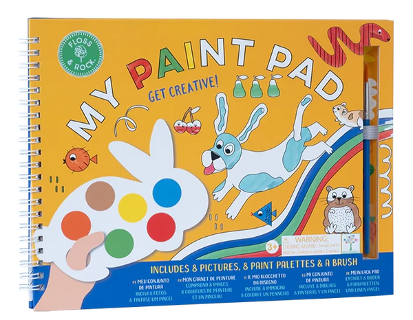 A child's spiral-bound painting book titled "Floss & Rock My Painting Pad, Pets" featuring animal illustrations, including a rabbit-shaped palette, 8 paint colors, and a brush. This eco-friendly paint pad with tear-out pictures is suitable for ages 3+.