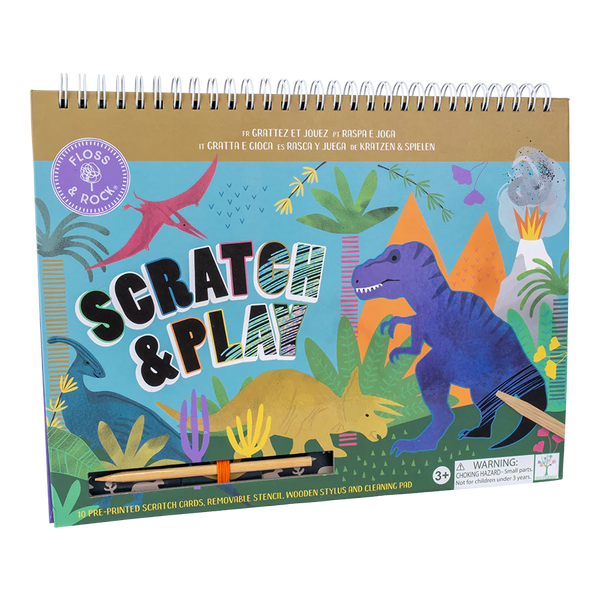 Cover of a "Floss & Rock Scratch & Play, Dino" activity book featuring vibrant dinosaur illustrations, wooden styluses, and eco-friendly scratch cards for children aged 3 and up by Floss and Rock.