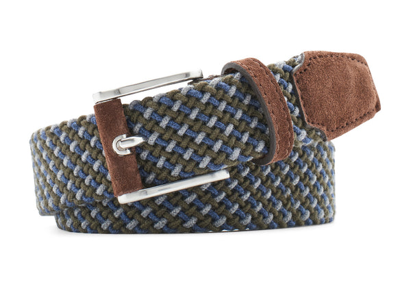 The Peter Millar Crafted Multi-Color Woven Wool Belt, made in Italy, features a silver-toned buckle with shades of blue and green, complemented by brown leather detailing on the ends and loop.