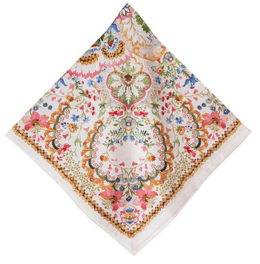 The Juliska Sofia Napkin, part of a set of four by Juliska, features a fantasy garden of blossoms with floral and ornate designs on a white background made from cotton sateen. Its vibrant hues bring this exquisite piece to life, making it perfect for adding a touch of elegance to any setting.