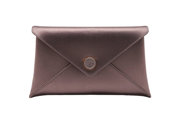 A smooth satin envelope-style clutch featuring a round medallion button closure at the center, adorned with the Altuzarra logo: the Altuzarra Medallion Satin Envelope Clutch by Altuzarra.