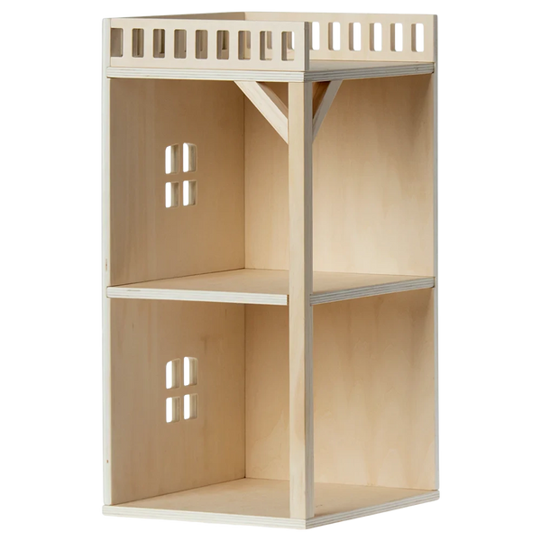 A wooden two-shelf display unit featuring lattice-style top edges and small square cutouts on the back panel, specifically crafted for home or office storage. It's perfect to complement Maileg's Mouse Hole Farmhouse - Annex collection or add a charming touch reminiscent of the Mouse Hole Farmhouse decor from Maileg.