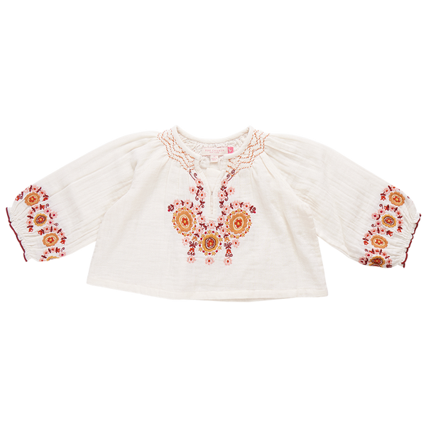 A white, long-sleeve Pink Chicken Girls' Ava Top in toddler size, featuring vibrant orange and pink floral harvest embroidery on the chest and cuffs, perfect for a touch of boho fashion.