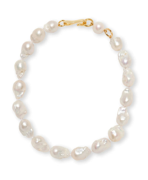 The Lizzie Fortunato Claude Necklace by Lizzie Fortunato features baroque pearls elegantly strung with a gold-plated brass clasp.