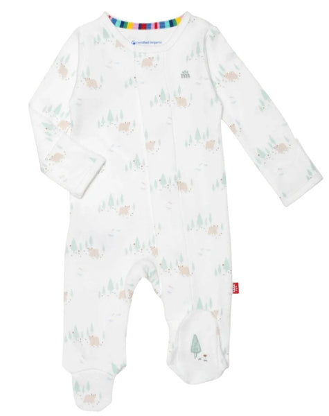 The Magnetic Me Babe in the Woods Footie by Magnetic Me is a white long-sleeve infant onesie crafted from GOTS certified organic cotton, boasting a subtle forest animal pattern and a multicolor neckline trim, making it an essential addition to any baby wardrobe.