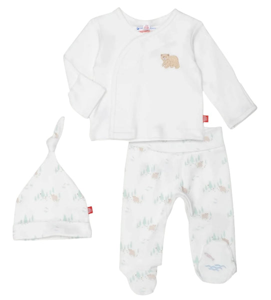 Introducing the Magnetic Me Babe In the Woods Kimono Set by Magnetic Me: a charming three-piece outfit for babies in pristine white soft organic cotton, featuring a long-sleeve shirt adorned with bear embroidery, patterned pants showcasing bear and tree prints, and a matching knotted hat.