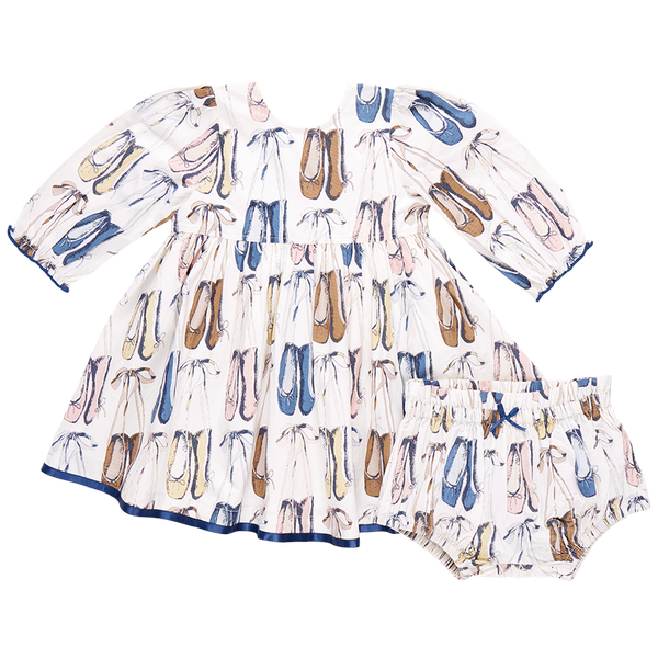 The Pink Chicken Baby Girls' Amma Dress by Pink Chicken is a charming white cotton poplin baby dress that comes with a matching bloomer, both beautifully adorned with ballet slippers in an array of colors. This lovely outfit is perfect for your little dancer!