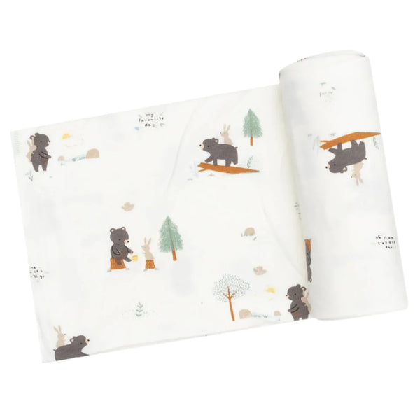 The Angel Dear Bear and Bunny Adventures Swaddle Blanket is crafted from bamboo fabric adorned with prints of brown bears, trees, and rabbits in playful poses, making it ideal for creating cozy nursing swaddles.