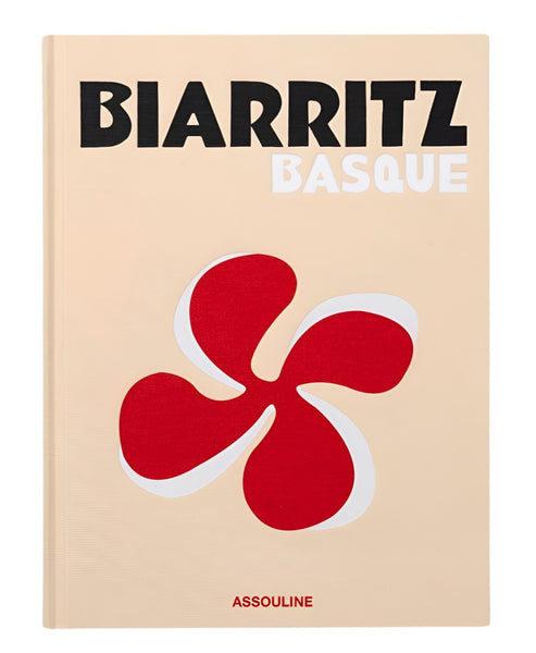 Cover of the book "Biarritz Basque" showcasing a red and white stylized symbol that captures the essence of the Basque Country, with the brand name Assouline at the bottom.