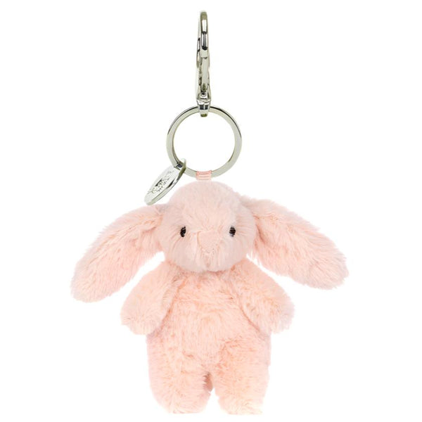 Rewrite: The Jellycat Bashful Bunny Bag Charm by Jellycat is a pink plush bunny keychain with floppy ears and a metal key ring, making it a perfect accessory for your backpack or beige bag.