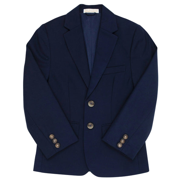 Introducing The Beaufort Bonnet Company Booker Blazer in Nantucket Navy: a stylish navy blue blazer with notch lapels, three front buttons, a chest pocket, and two side pockets. The sleeves feature four button cuffs, epitomizing preppy perfection.