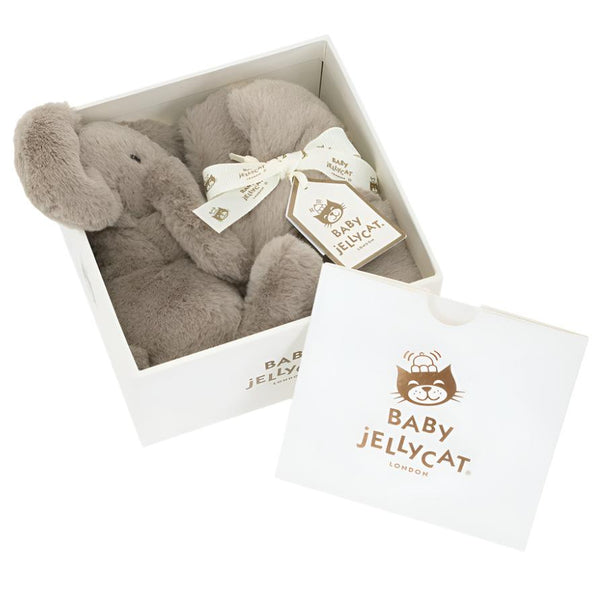 A Jellycat Smudge Elephant Soother in Giftbox, partially wrapped in a white ribbon with tags, is presented as the perfect newborn gift in a white box labeled "Baby Jellycat London." The soft toy peeked out from the partially open box lid beside it.