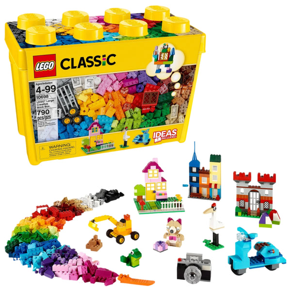 A yellow LEGO® Classic Large Creative Brick Box branded by Legos - Toyhouse, featuring an assortment of colorful bricks and small constructed models including a house, train, dinosaur, and flower displayed in front. This creative toolkit contains 790 LEGO bricks, making it perfect for budding builders.