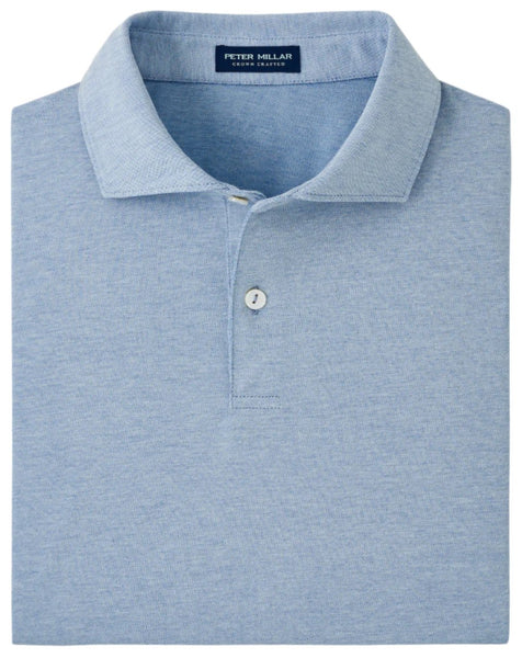 A neatly folded Peter Millar Albatross Cotton Blend Piqué Polo in light blue, featuring a soft cotton blend with subtle piqué knit and a single visible button.