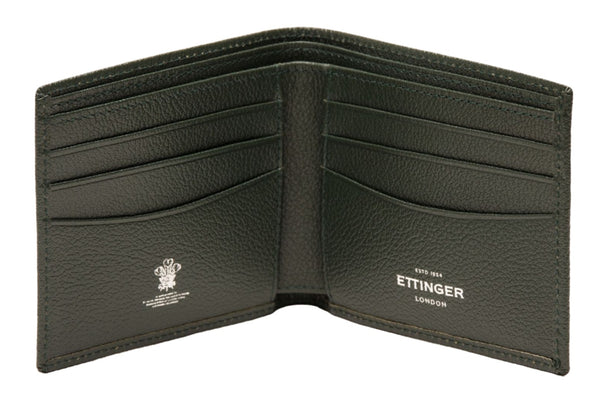 Open dark green goat leather wallet with multiple card slots and "Ettinger London" embossed in white text. This Ettinger Capra Billfold 6 Credit Card Wallet epitomizes luxury in every detail.