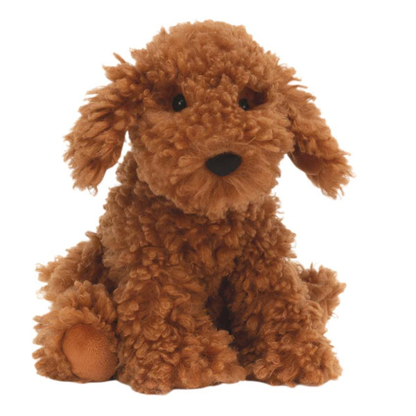 A soft pup that looks like the toffee-colored Jellycat Cooper Labradoodle Pup is sitting facing forward on a white background.