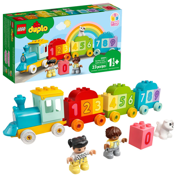 The LEGO® DUPLO® Number Train - Learn To Count set from Legos - Toyhouse features a vibrant train with numbered blocks from 0 to 9, two child figurines, and a white puppy. The packaging displays a rainbow background, making it perfect for toddler play for ages 1.5 and up.