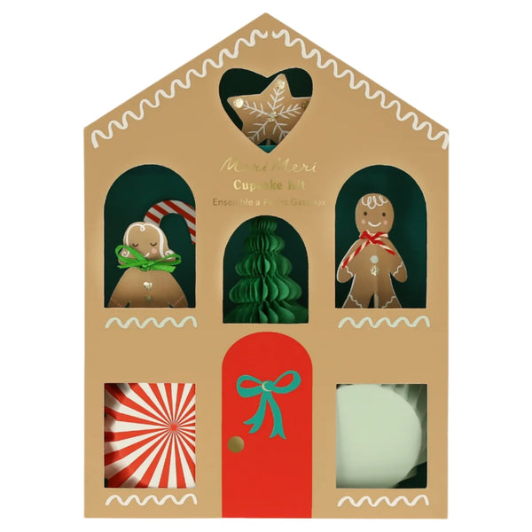 This imaginative gift, the Meri Meri Gingerbread Cupcake Kit, is designed like a house-shaped box with gingerbread figures, a Christmas tree, and festive designs visible through cut-out windows. Perfect for the holiday season, it includes 24 toppers to add extra joy and cheer.