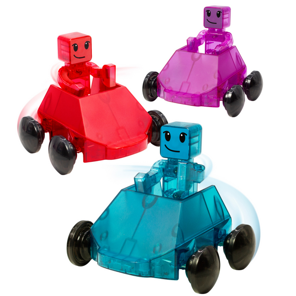 The MAGNA-TILES® Dashers 6-Piece Set by Magnatiles includes three small, transparent toy cars featuring smiling, block-like figures inside: one red, one purple, and one blue, each equipped with four wheels. Designed for frustration-free play, these fun vehicles pair perfectly with MAGNA-TILES® for imaginative adventures.