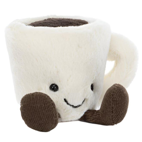 The Jellycat Amuseables Espresso Cup by Jellycat is a plush toy designed in the shape of a white coffee cup with a handle, featuring a smiling face and adorable chocolatey cordy feet and arms.