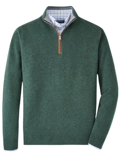 The Peter Millar Artisan Crafted Cashmere Flex Quarter-Zip for men, designed in a tailored fit and showcasing a rich forest green hue, features a brown zipper pull and layers elegantly over a blue checkered shirt. This luxurious sweater is crafted from premium Italian cashmere by Peter Millar.