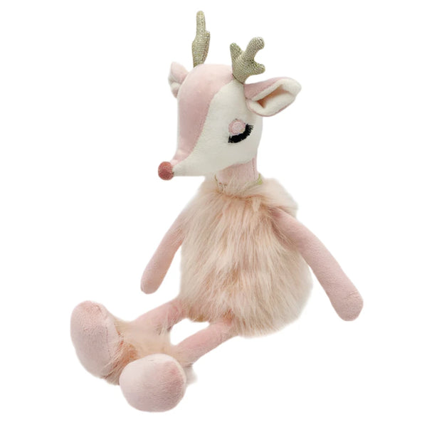 The MON AMI Freija the Pink Reindeer by Mon Ami is a stuffed toy deer featuring pink faux fur, a long snout, gold antlers, and closed eyes. It sits upright and has plush limbs along with a fluffy chest.