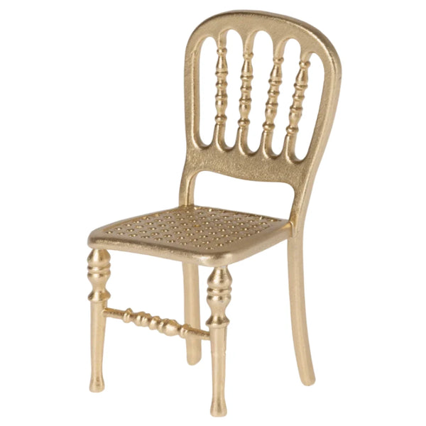 The Maileg Gold Chair, Mouse, with its ornate backrest and perforated seat, is a perfect fit for a Maileg mouse castle.