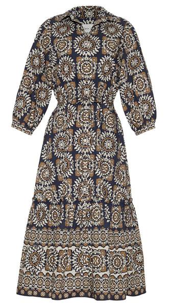 The Cara Cara Hutton Dress by Cara Cara is a long-sleeved, knee-length shirt dress with a cinched waist, showcasing an intricate floral and geometric pattern in black, white, and tan.