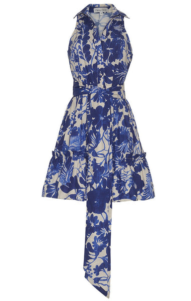 The Cara Cara Hannah Mini Dress by Cara Cara is a sleeveless collared mini dress with a button-up bodice, featuring a blue and white floral pattern and an asymmetrical hemline.