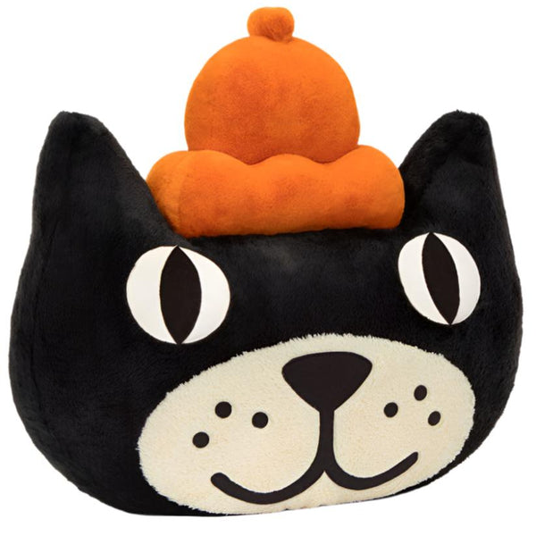 A playful statement, the Jellycat Head, Giant plush toy from Jellycat is shaped like an ink-black cat head with wide eyes, a white snout, and an orange hat on top.