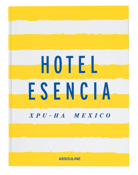 The cover of "Hotel Esencia" by Assouline exudes understated luxury, featuring blue text on a yellow and white striped background that captures the essence of Riviera Maya.