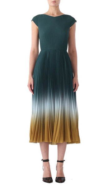 A person wearing a Jason Wu Collection Dip Dye Marocaine Crepe Pleated Dress and black heeled shoes with ankle straps.