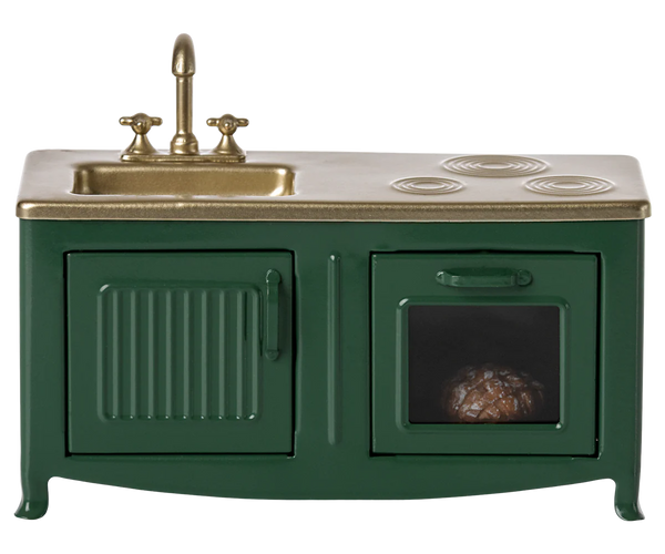 The Maileg Kitchen, Mouse - Dark Green by Maileg is a charming miniature toy kitchen set featuring a dark green sink with a faucet, a stovetop, and an oven with a small item inside, ideal for the Mouse family kitchen.