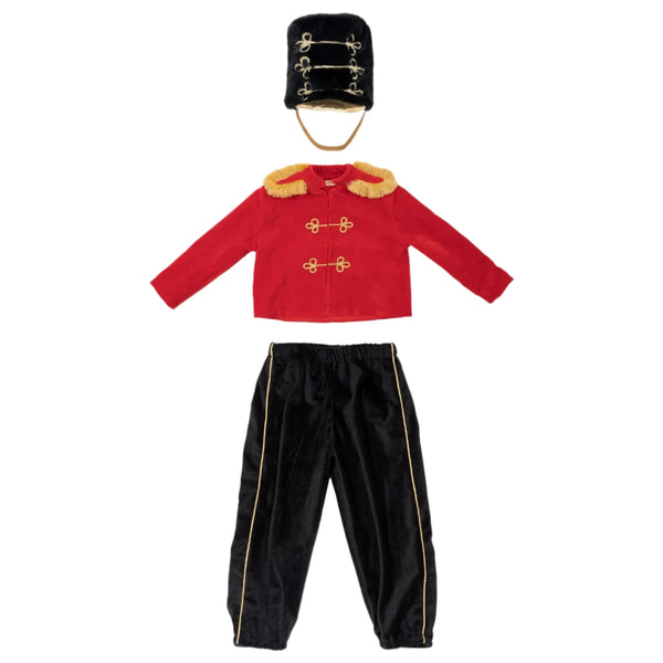 The Meri Meri Little Drummer Costume, offered by the brand Meri Meri, is a luxurious Christmas outfit that includes a red velvet jacket, black pants with gold stripes, and a tall black hat adorned with plush gold embellishments, all elegantly displayed on a pristine white background. Ideal for imaginative play.