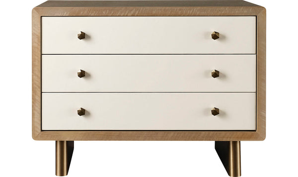 A modern wooden Waterfall Nightstand with a refined finish features three white drawers, each adorned with two gold knobs. Standing on short gold legs, this elegant piece by McGuire Furniture effortlessly combines style and functionality.