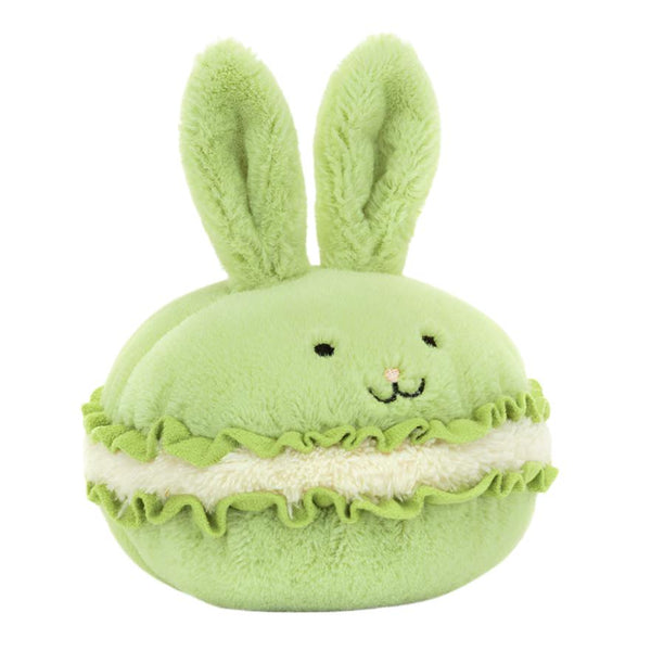 The Jellycat Dainty Dessert Bunny Macaron, crafted by Jellycat, is an adorable plush toy resembling a green macaron with bunny ears and a cheerful smile, making it the perfect dessert-themed bunny companion.