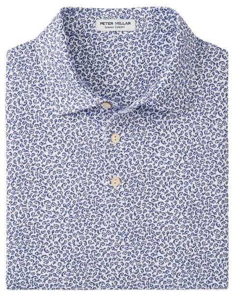 The Peter Millar Mahi Mahi Performance Jersey Polo features a blue and white paisley print with a folded collar and three front buttons, along with moisture-wicking technology for all-day comfort.