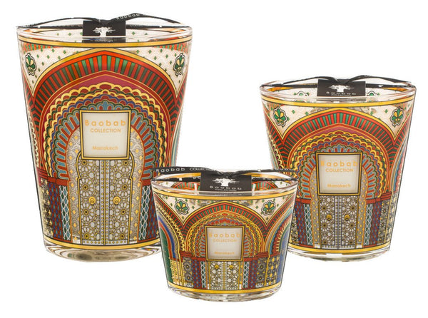 Three Baobab Collection Marrakech candles of varying sizes, featuring intricate multicolored patterns and the enchanting aroma of orange blossom.