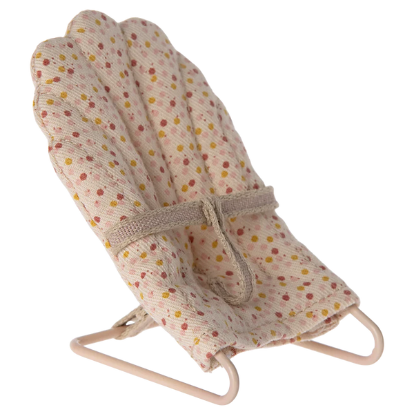 Introducing the Maileg Babysitter, My by Maileg: a small, padded baby sitter with a white fabric cover featuring multicolored polka dots and a beige harness, mounted on a pink metal frame. The primary material is soft fabric, ensuring comfort and safety for your little one.