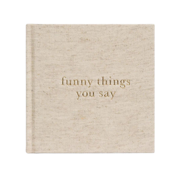 A Write To Me Funny Things You Say Oatmeal journal by Write To Me is titled "funny things you say" in gold letters on the cover, perfect for jotting down memorable quotes from your kids.