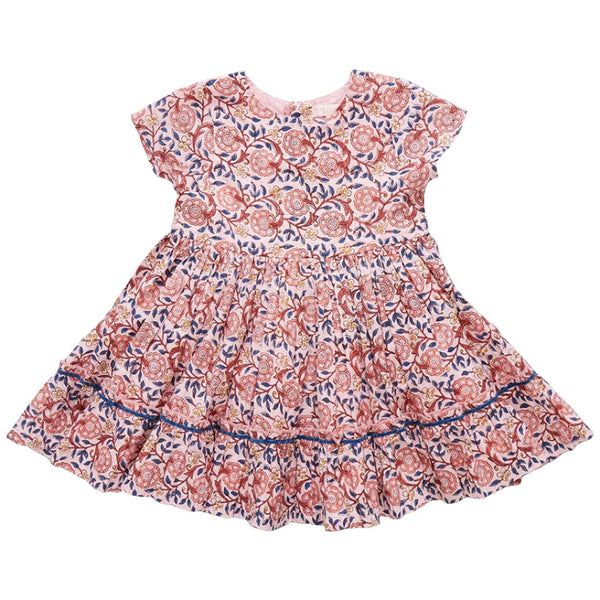 A Pink Chicken Girls' Niley Dress, featuring a pink and blue floral pattern, short sleeves, a gathered waist, and a ruffled hem, laid flat on a white background, emanates the charm of the Garden Of Dreams.