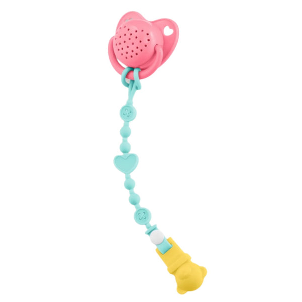 The Corolle Baby Pacifier with Sound features a pink pacifier adorned with a heart design, accompanied by a turquoise and yellow clip decorated with heart and bear shapes. It's an ideal accessory for the Corolle baby doll from the Mon Grand Poupon Collection.