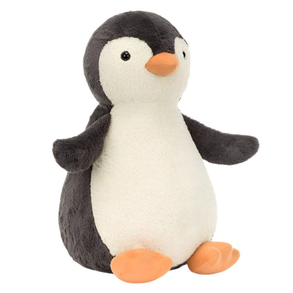 Introducing the Jellycat Peanut Penguin, Really Big—a charming vintage-inspired plush toy by Jellycat. It features a gray back, white belly, and orange beak and feet. This cuddly companion sits upright against a plain background, ready to add charm and comfort to any room.