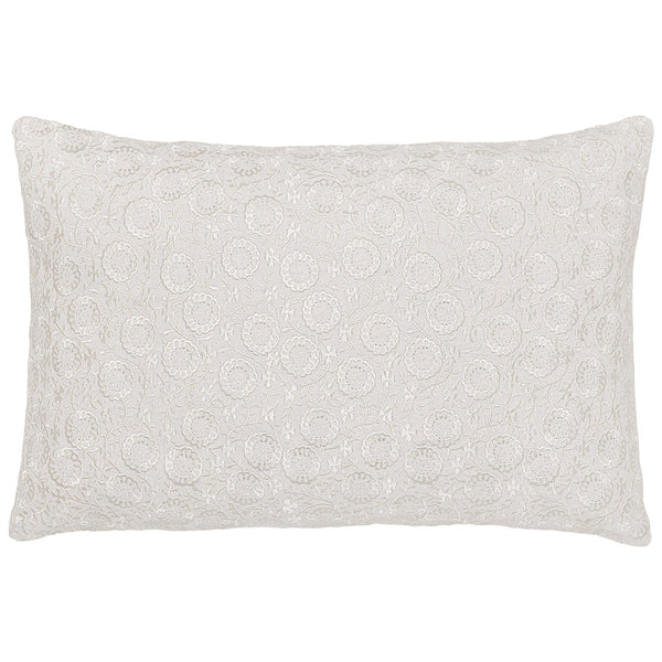 A John Robshaw Chandra Natural Kidney Pillow with an intricate white lace pattern on its surface, offering a romantic look.