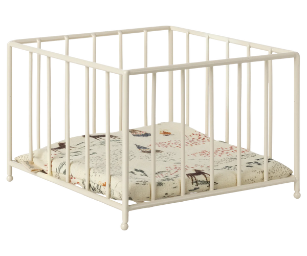 The Maileg Playpen, Micro by Maileg is a white square baby playpen with vertical bars and a cushioned base featuring a nature-themed print, perfect also as a small animal play area.