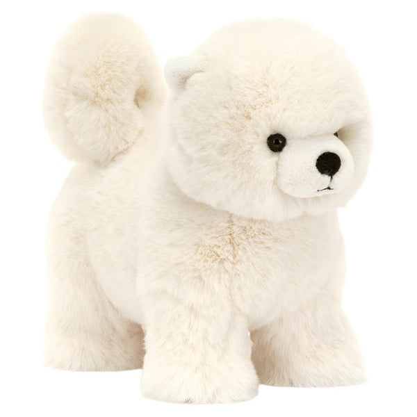 The Jellycat Daphne Pomeranian, a fluffy white plush toy with a curled tail and black eyes, is shown standing on a plain background.