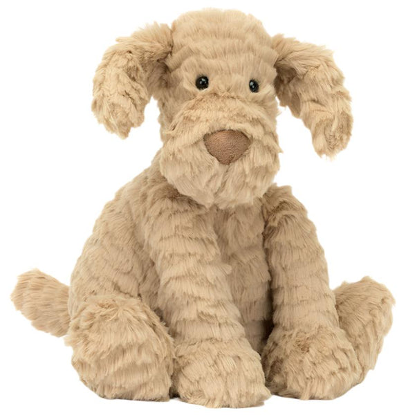 A silky-soft Jellycat Fuddlewuddle Puppy with floppy ears and light brown, textured fur sits upright against a white background.